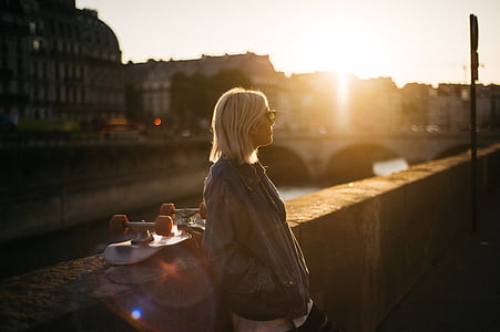 woman standing in front of fence thumbnail