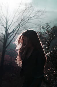 woman standing under clear sky during daytime thumbnail