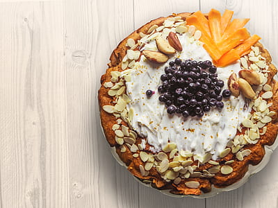 Pastry With Nuts Sliced Mangoes and Blackberries on Top thumbnail