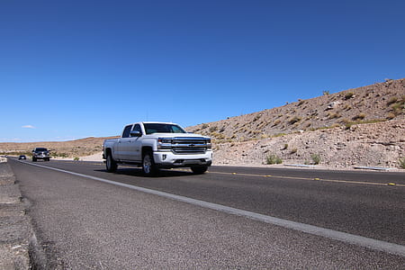 white Chevrolet pickup truck parked on road thumbnail