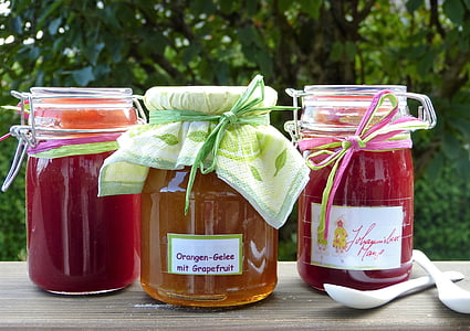three labeled mason jars beside two white spoons thumbnail