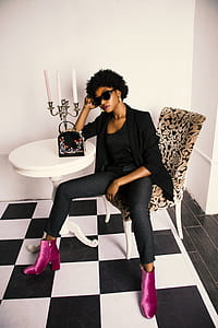 Woman in Black Shirt and Blazer Sitting on White and Brown Wooden Chair thumbnail