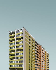 green and white high-rise building thumbnail