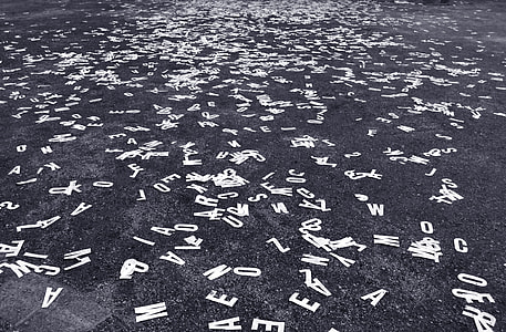 cut out letter scattered on concrete surface thumbnail