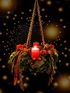 lighted red candle hanging on decor thumbnail