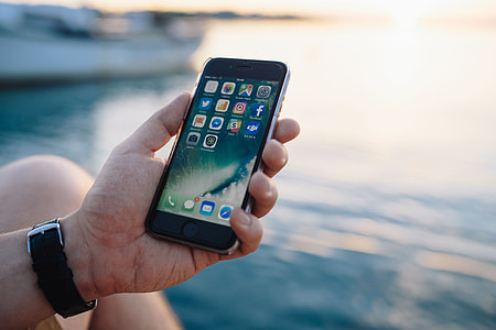 Mobile phone in man's hands near the sea thumbnail