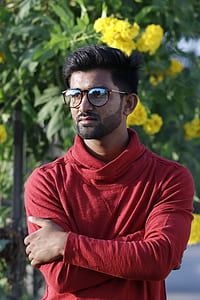 selective photo of man standing wearing eyeglasses thumbnail