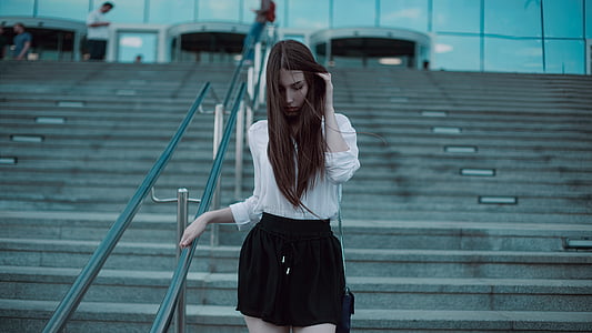 woman wearing black and white long-sleeved dress thumbnail