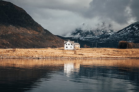 white house with glassy water reflection thumbnail
