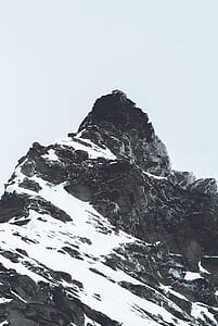 snow cover mountain during gray cloudy skies thumbnail