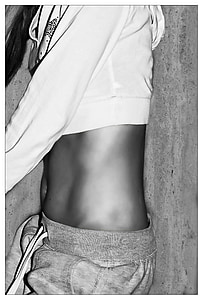 woman wearing white crop-top jacket and drawstring pants lying on surface thumbnail