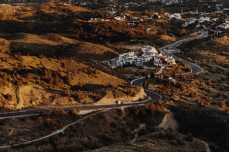 Bird's Eye View Photograph of Curvy Asphalt Road thumbnail