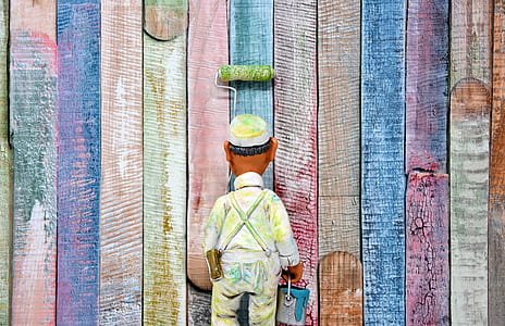 man carrying bucket of paint thumbnail