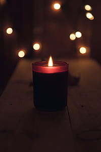 shallow focus photography of black votive candle thumbnail