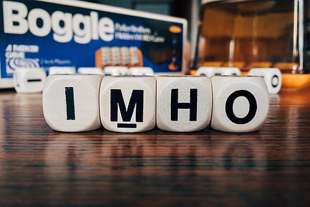 imho cube letters on wooden surface thumbnail