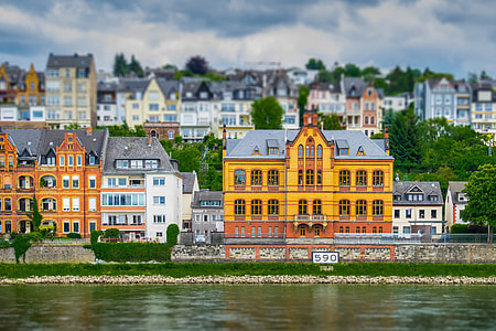 yellow concrete building near body of water thumbnail