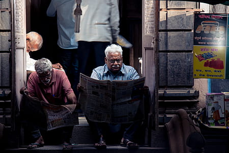 Two Men Reading Newspaper thumbnail