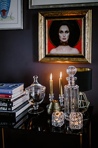 Decanter, candles, and a painting on the wall thumbnail