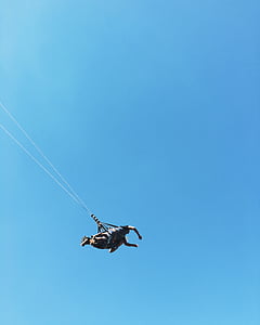 man floating in the air with harness thumbnail