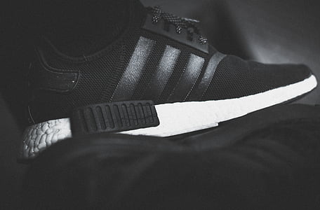 unpaired black and white adidas NMD thumbnail