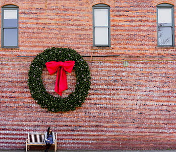 woman sitting on bench under the wreath thumbnail
