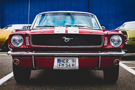 close-up photography of red Ford Mustang coupe thumbnail