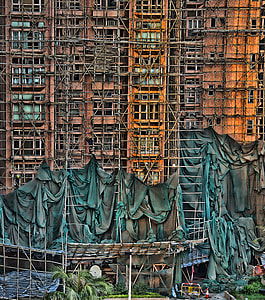 gray metal scaffolding on side of building painting thumbnail