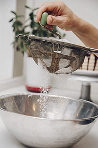person holding flour strainer thumbnail