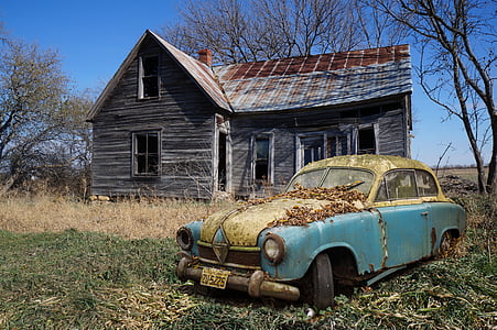 classic teal and beige car near abandoned brown wooden house thumbnail