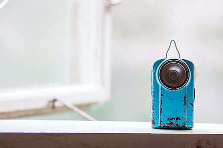 blue and black vintage camera on wood plank thumbnail