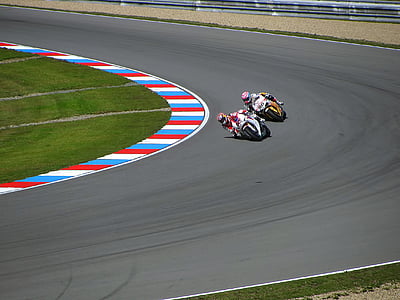 two men racing motorcycles thumbnail