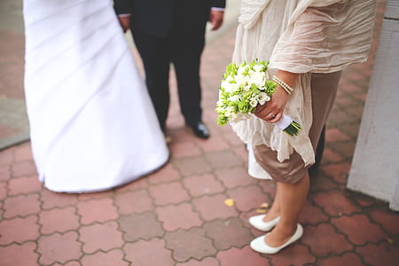 three people standing on pavement thumbnail