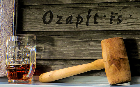 brown wooden mallet near clear glass beer mug filled with liquid thumbnail