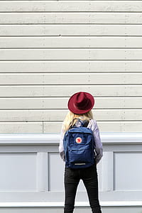 woman facing white wall thumbnail