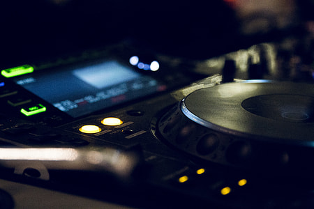 selective focus photography of turned on DJ controller thumbnail