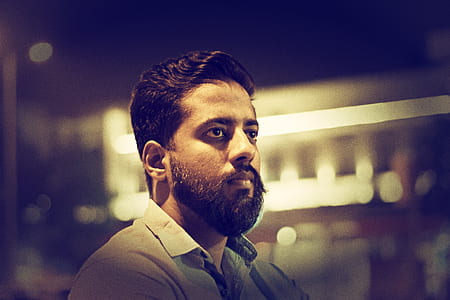 low light portrait photo of man in gray collared shirt thumbnail