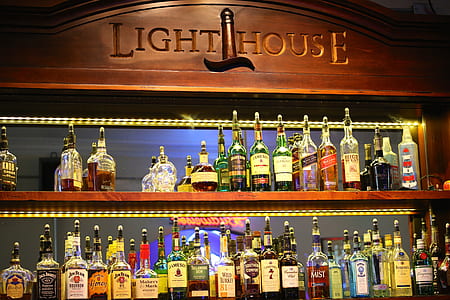 bottles on brown wooden shelf thumbnail