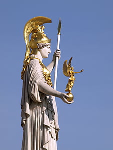 man holding spear statue under sunny sky thumbnail