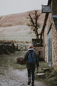 person walking beside grass thumbnail