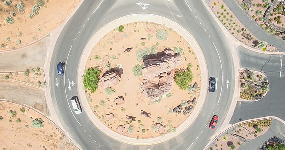 Aerial Photo of Four Cars on round about at Daytime thumbnail