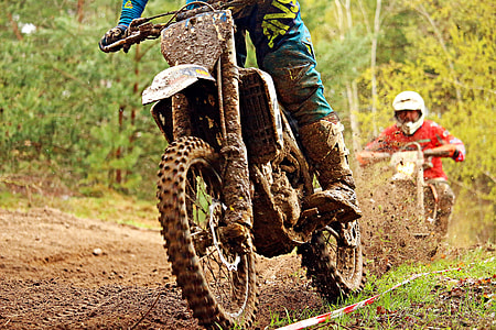 two men riding motocross dirt bikes thumbnail