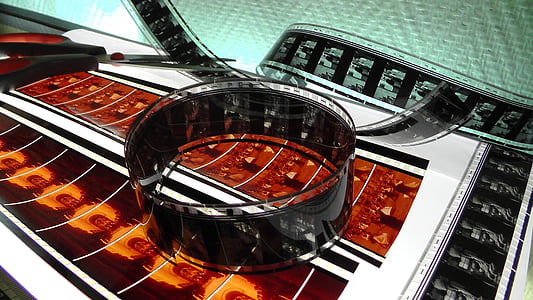 film negatives beside black scissor thumbnail
