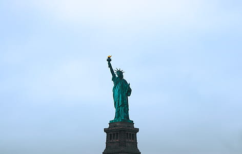 Statue of Liberty under white clouds thumbnail