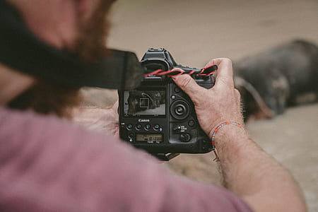 person holding camera thumbnail
