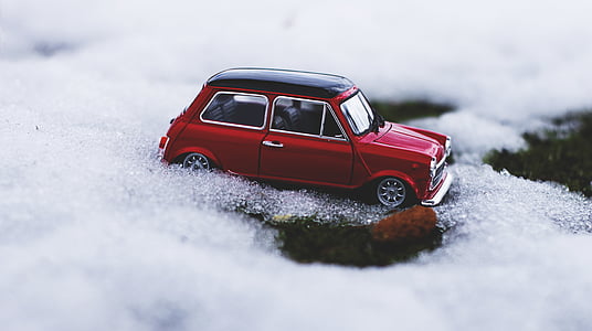 focus photo of red 3-door hatchback toy on bubbles thumbnail