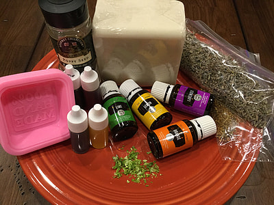 eight glass bottles beside pink plastic container thumbnail