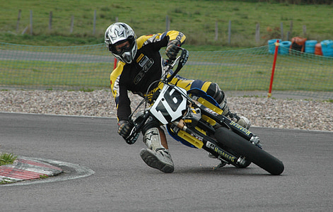 man riding bike on track thumbnail