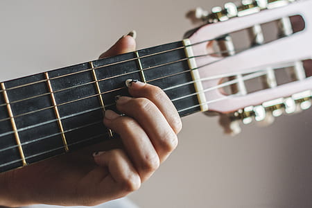 woman playing guitar thumbnail