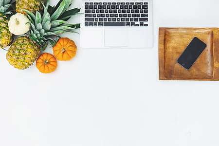 pineapple and squash beside white laptop keyboard thumbnail