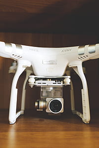 white DJI Phantom Advance on brown surface thumbnail